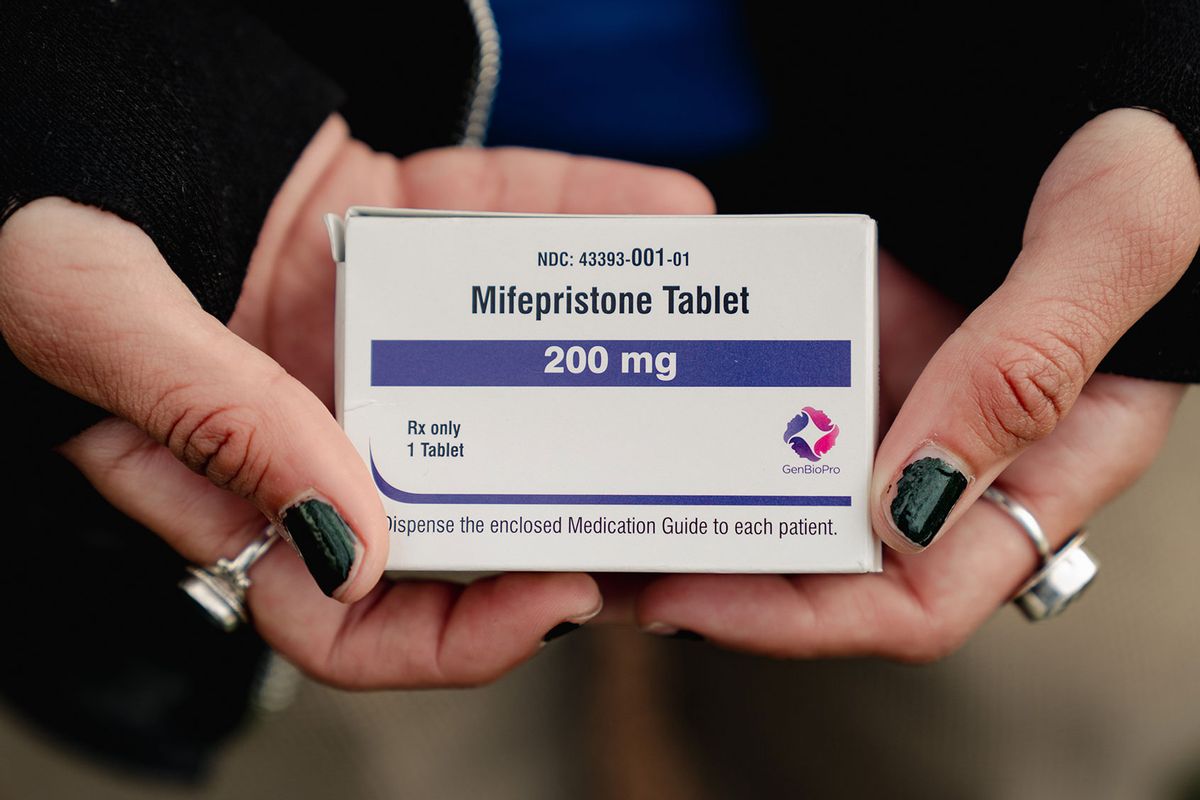 Trans man and abortion rights advocate Artemis Duffy of New England shows a box of mifepristone he is taking outside the Supreme Court in Washington, DC, on March 26, 2024. (Shuran Huang for The Washington Post via Getty Images)
