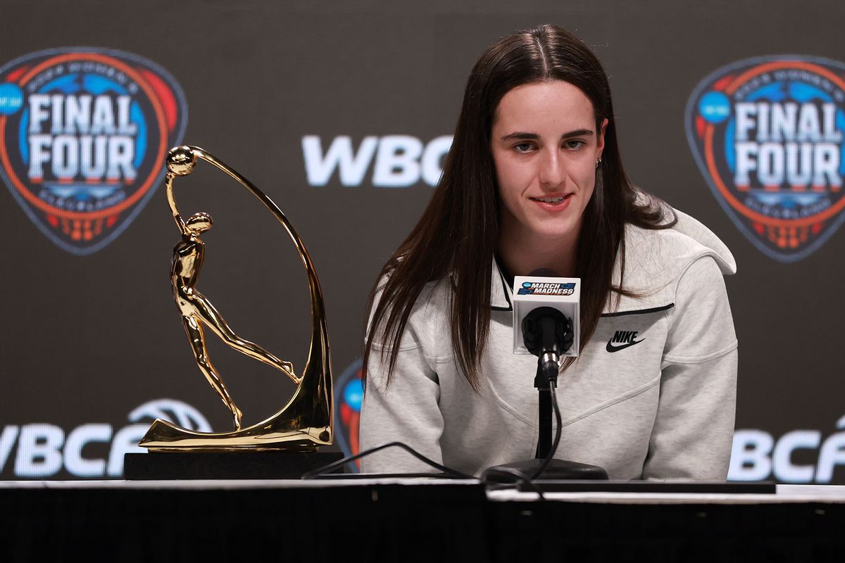Caitlin Clark #22 of the Iowa Hawkeyes speaks after accepting the WBCA Wade Trophy during a press conference ahead of the 2024 NCAA Women's Basketball Tournament Final Four at Rocket Mortgage Fieldhouse on April 04, 2024 in Cleveland, Ohio. (Gregory Shamus/Getty Images)