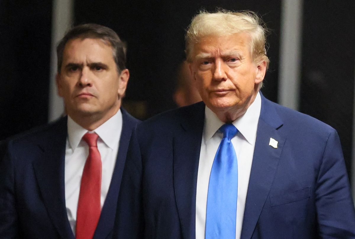 Former president and Republican presidential candidate Donald Trump, flanked by lawyer Todd Blanche (L) arrives at Manhattan Criminal Court to attend his trial for allegedly covering up hush money payments linked to extramarital affairs in New York, on April 22, 2024. (BRENDAN MCDERMID/POOL/AFP via Getty Images)