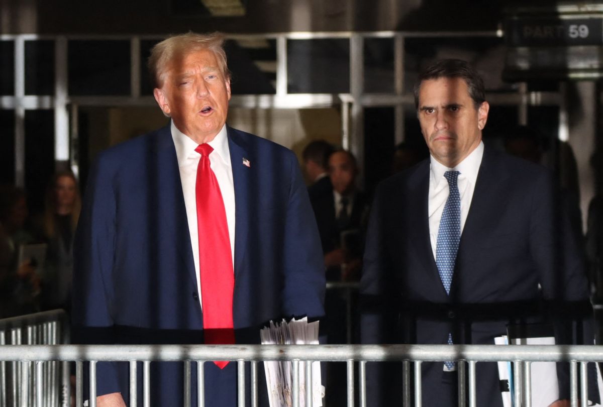 Former President Donald Trump, with attorney Todd Blanche (R), speaks to the press after attending his trial for allegedly covering up hush-money payments linked to extramarital affairs, at Manhattan Criminal Court in New York City on April 23, 2024. (JOHN TAGGART/POOL/AFP via Getty Images)