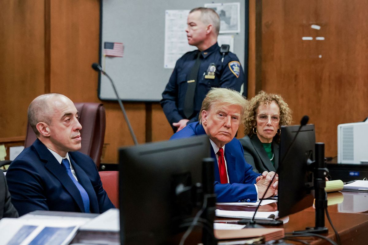 Former US President Donald Trump (C) and attorney Susan Necheles (R) attend a hearing to determine the date of his trial for allegedly covering up hush money payments linked to extramarital affairs, at Manhattan Criminal Court in New York City on March 25, 2024. (JUSTIN LANE/POOL/AFP via Getty Images)