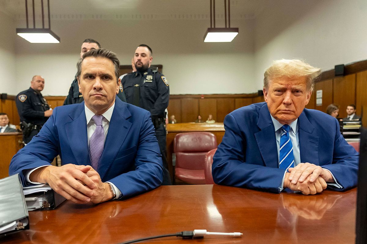 Former US President Donald Trump (R) with his attorney Todd Blanche, attends the second day of his trial for allegedly covering up hush money payments linked to extramarital affairs, at Manhattan Criminal Court in New York City on April 16, 2024. (MARK PETERSON/POOL/AFP via Getty Images)