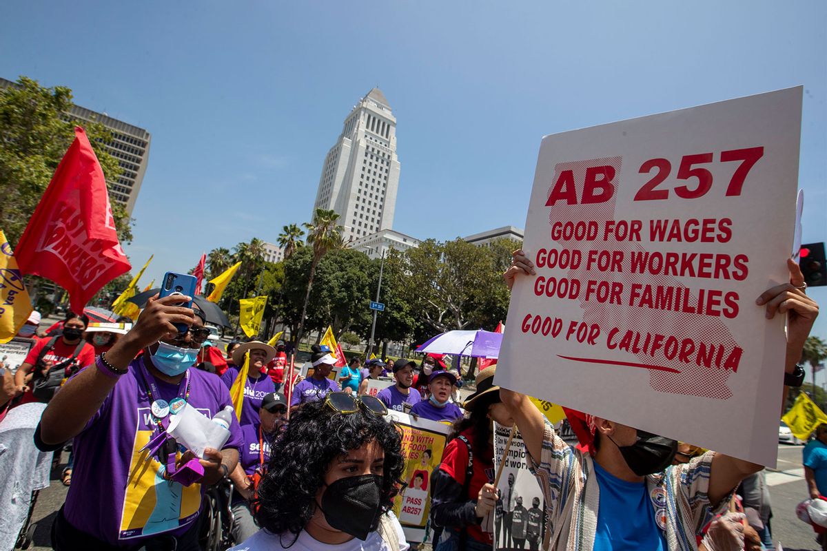 Fast-food workers lead a march to the state building on Spring Street after rally at Los Angeles City Hall to protest unsafe working conditions, and to demand a voice on the job through AB 257 Thursday June 8 2022 in Los Angeles. (Brian van der Brug/Los Angeles Times via Getty Images)
