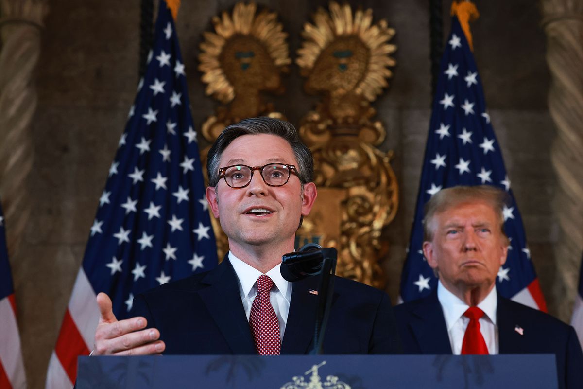 Donald Trump listens as Speaker of the House Mike Johnson speaks during a press conference at Mr. Trump's Mar-a-Lago estate on April 12, 2024, in Palm Beach, Florida. (Joe Raedle/Getty Images)