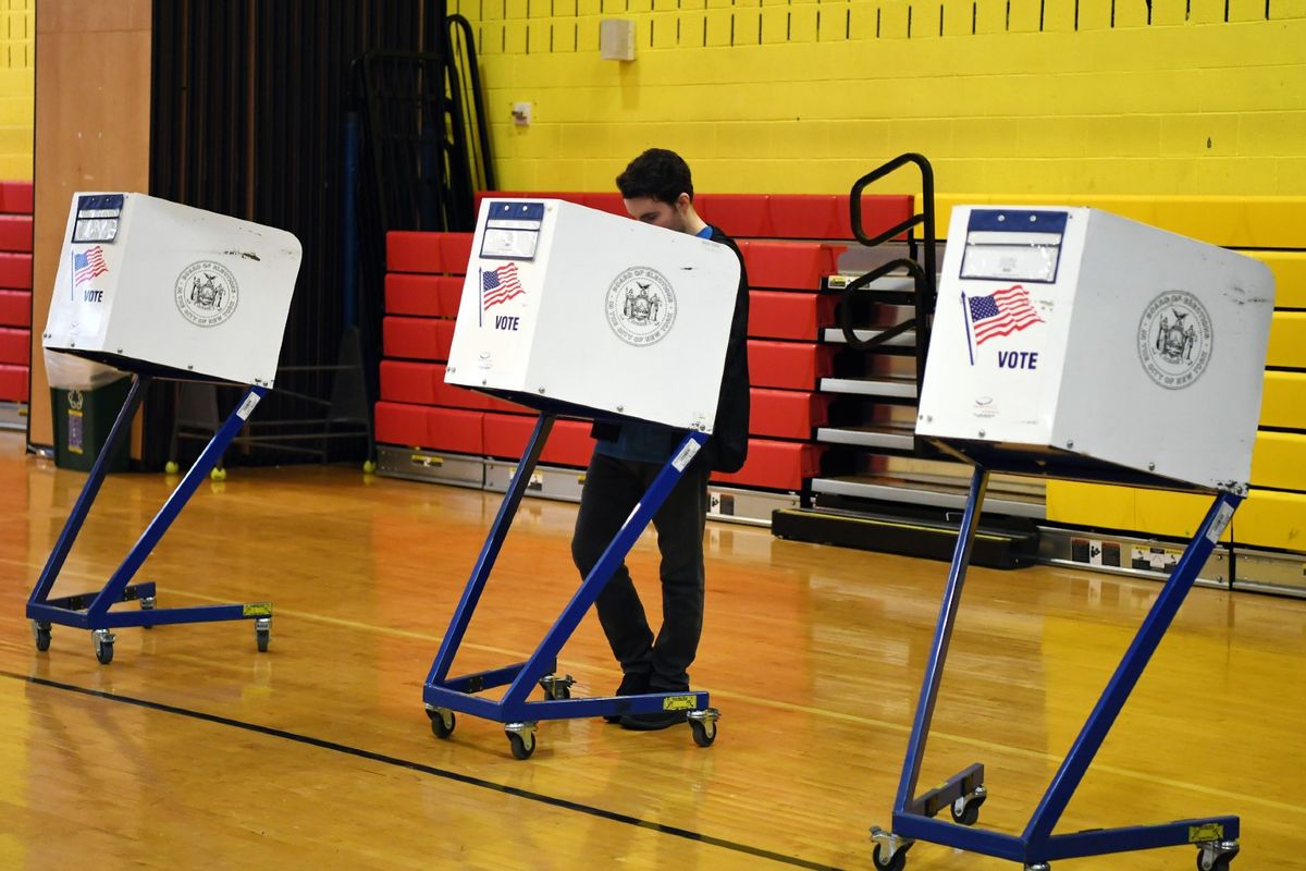 A voter fills in his ballot at a polling station in New York on April 2, 2024.  (Li Rui/Xinhua via Getty Images)