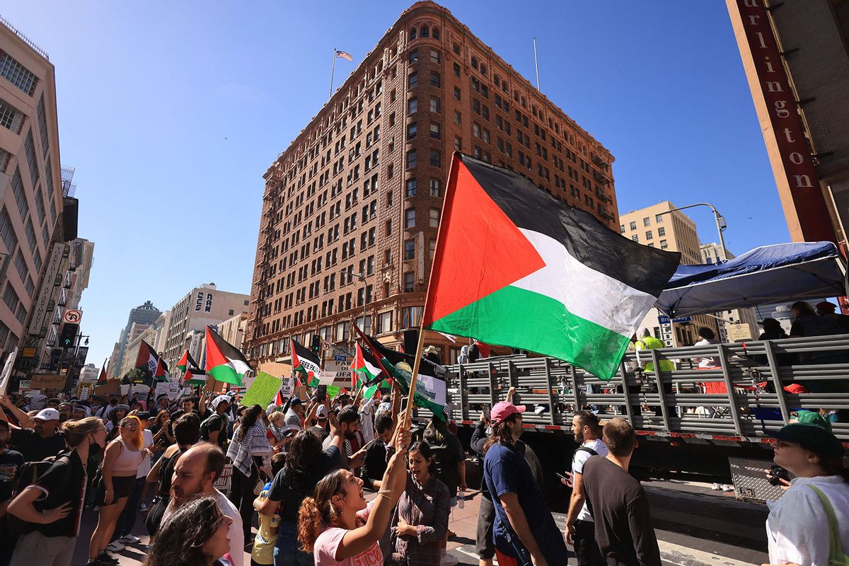 Protestors wave Palestinian flags as people rally in support of Palestinians in Los Angeles, California on October 21, 2023, amid ongoing conflict between Israel and Hamas. (DAVID SWANSON/AFP via Getty Images)