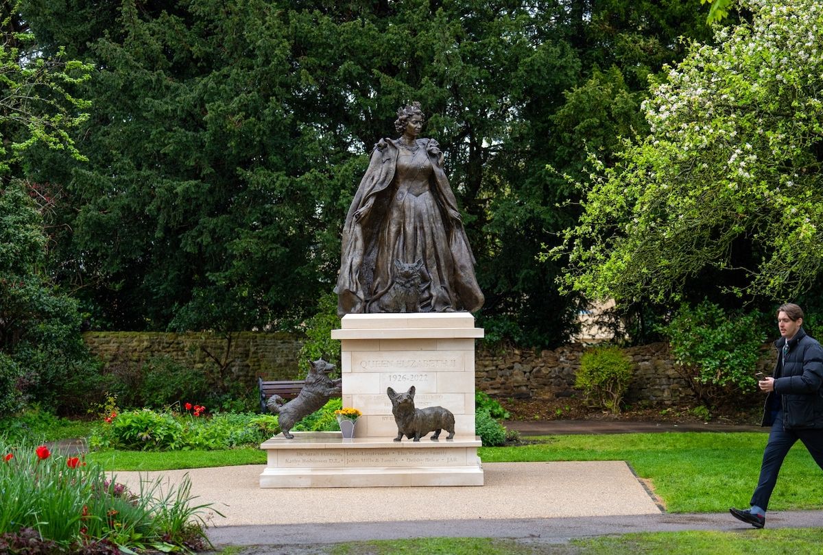 Queen Elizabeth II and her corgis statue taken on April 22, 2024 in Oakham, England. The statue is reportedly the first permanent memorial to the late monarch (Carl Court/Getty Images))