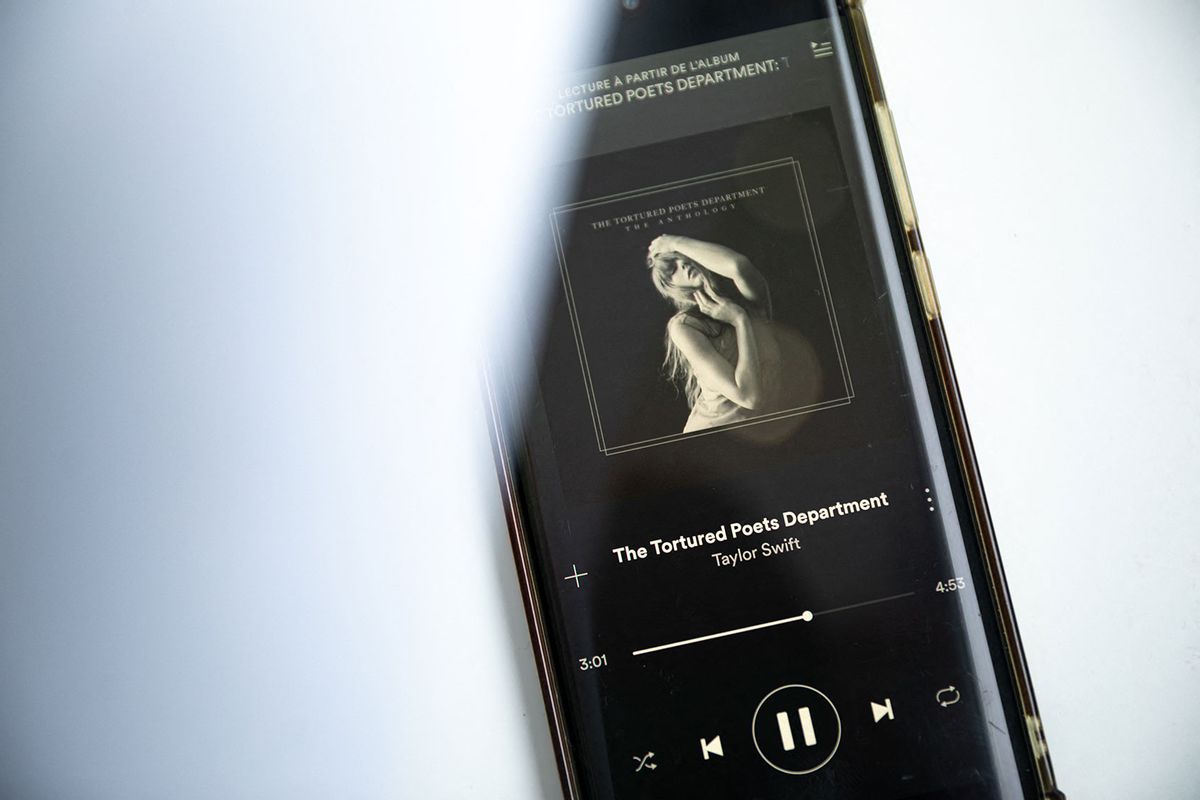 A smartphone displaying the US singer-songwriter Taylor Swift's new album "The Tortured Poets Department" on Spotify.  (AFP via Getty Images)