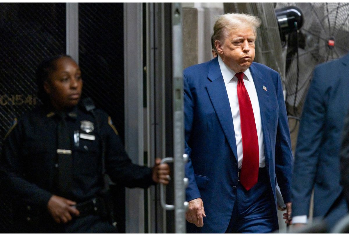 Former US President Donald Trump walks back to the courtroom after a break in his trial for allegedly covering up hush money payments linked to extramarital affairs, at Manhattan Criminal Court in New York City, on April 30, 2024.  (JUSTIN LANE/POOL/AFP via Getty Images)