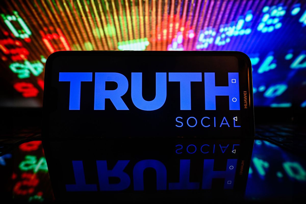 In this photo illustration, a Truth Social logo is displayed on a smartphone with stock market percentages on the background. (Photo Illustration by Omar Marques/SOPA Images/LightRocket via Getty Images)