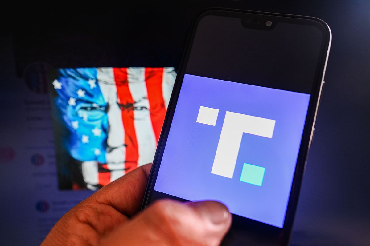 In this photo illustration, a Truth Social logo is displayed on a smartphone with Truth Social Donald Trump Account in the background. (Photo Illustration by Omar Marques/SOPA Images/LightRocket via Getty Images)