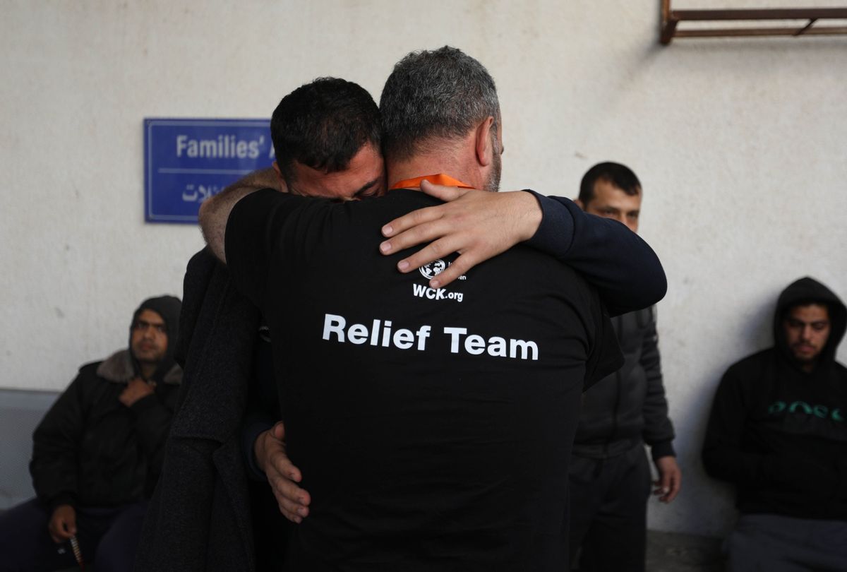 Two men comfort each other as they receive the bodies of World Central Kitchen workers who were killed by Israeli air strikes on April 02, 2024 in Rafah, Gaza. In a statement, the charity World Central Kitchen said that seven of its workers were killed while driving in a convoy after leaving a warehouse in Deir al-Balah, in central Gaza, where they had unloaded humanitarian food aid brought there via ship. (Ahmad Hasaballah/Getty Images)