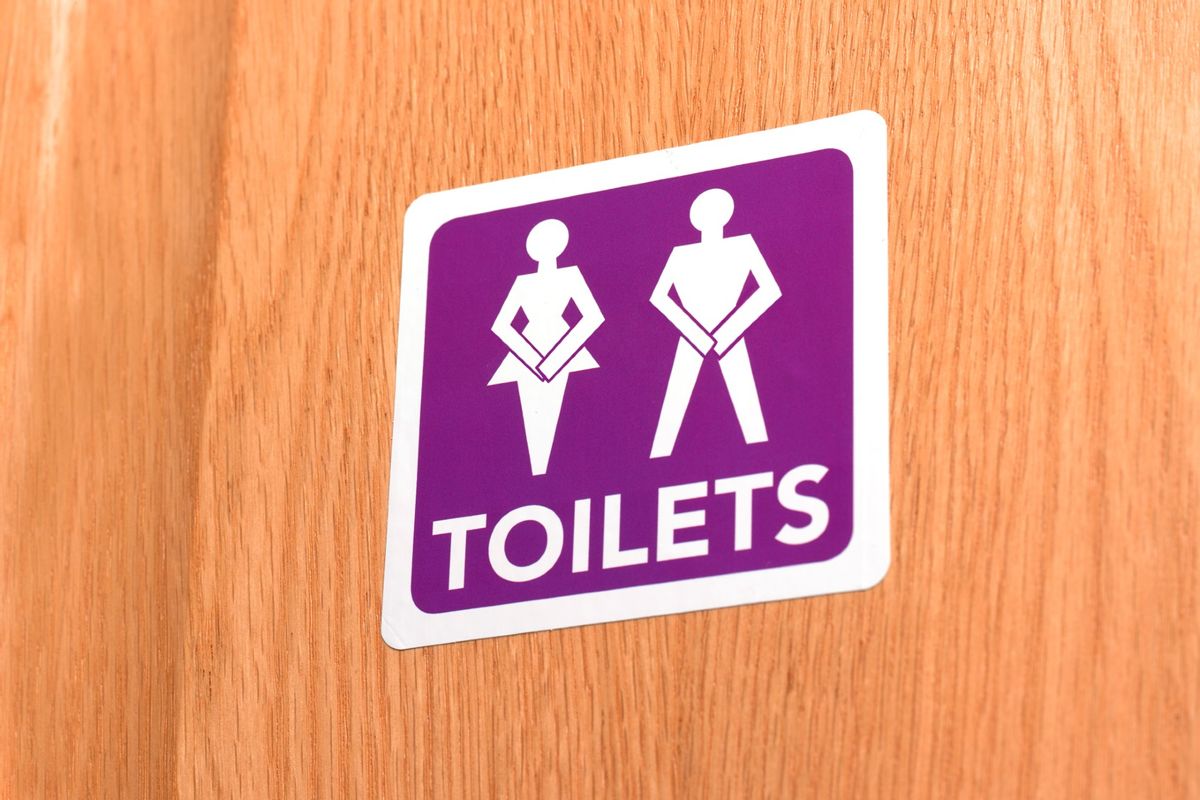 Gender neutral people desperate for the toilet, illustrated on door sign (Peter Dazeley/Getty Images)