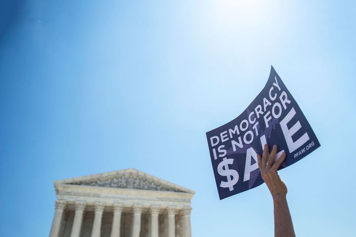 People gather outside of the Supreme Court to hear Senate Democrats unveil a constitutional amendment to overturn Citizens United in Washington on Tuesday July 30, 2019. (Caroline Brehman/CQ Roll Call/Getty Images)