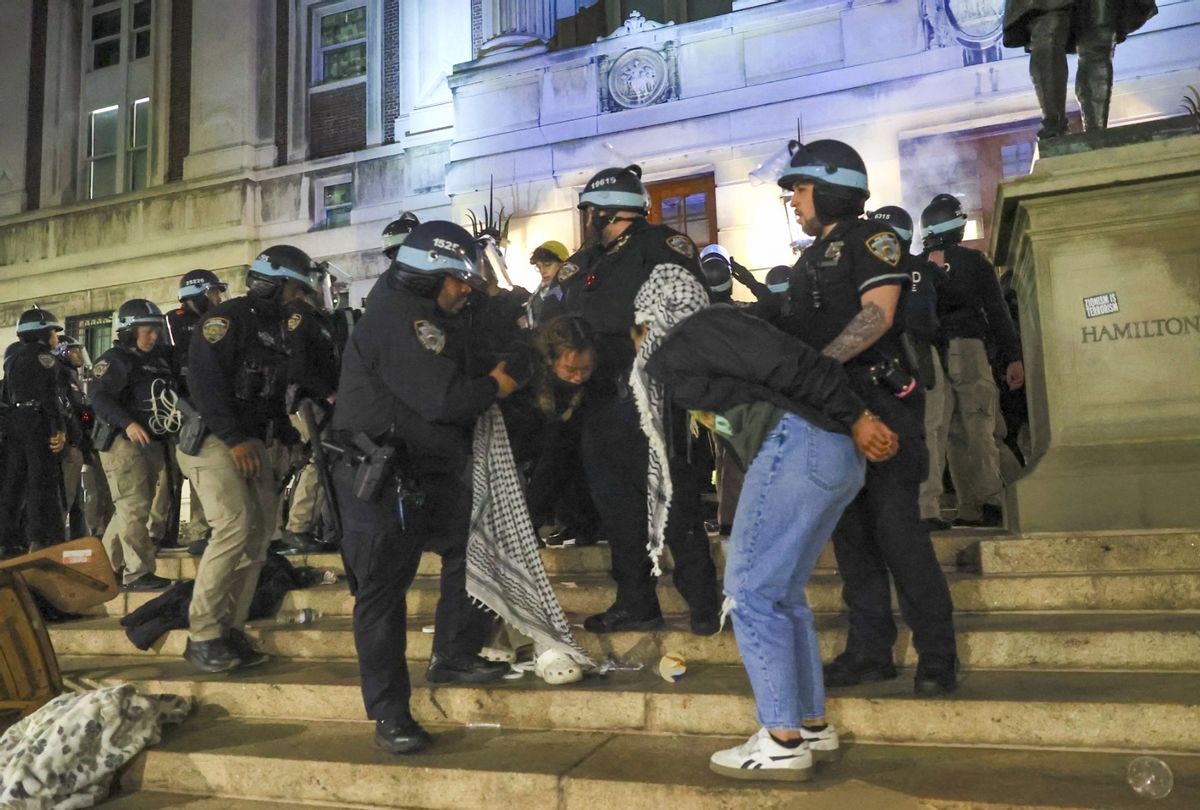 New York Police Department officers detain dozens of pro-Palestinian students at Columbia University after they barricaded themselves at the Hamilton Hall building near Gaza Solidarity Encampment earlier in New York, United States on April 30, 2024. (Selcuk Acar/Anadolu via Getty Images)