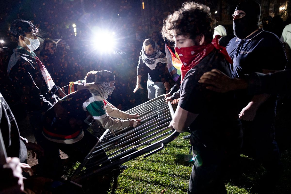 Counter protesters attack a pro-Palestinian encampment set up on the campus of the University of California Los Angeles (UCLA) as clashes erupt, in Los Angeles on May 1, 2024. (ETIENNE LAURENT/AFP via Getty Images)