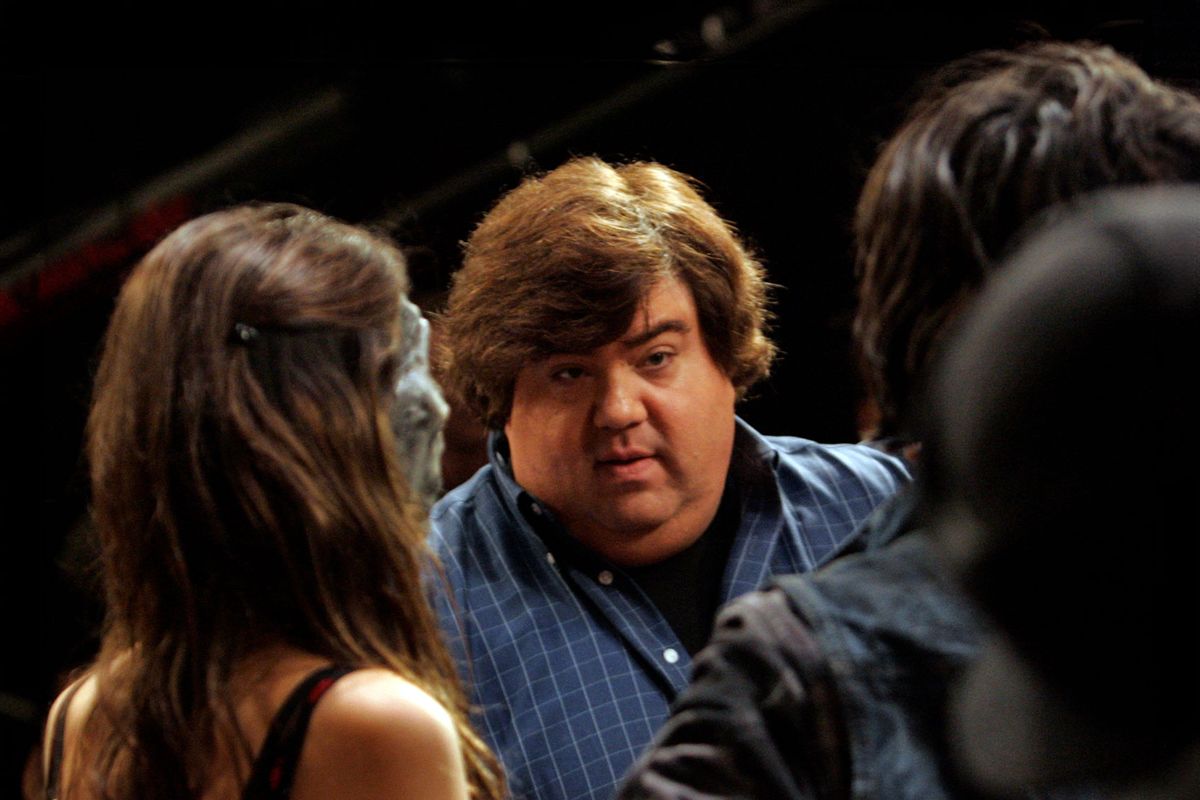 Show creator/exec. producer Dan Schneider (center) discussing the scene with stars Victoria Justice (left) and Avan Jogia (right) during the taping of a high school performance scene for the show Victorious at Nickelodeon's studio in Hollywood on Nov. 13, 2009. (Lawrence K. Ho/Los Angeles Times via Getty Images)
