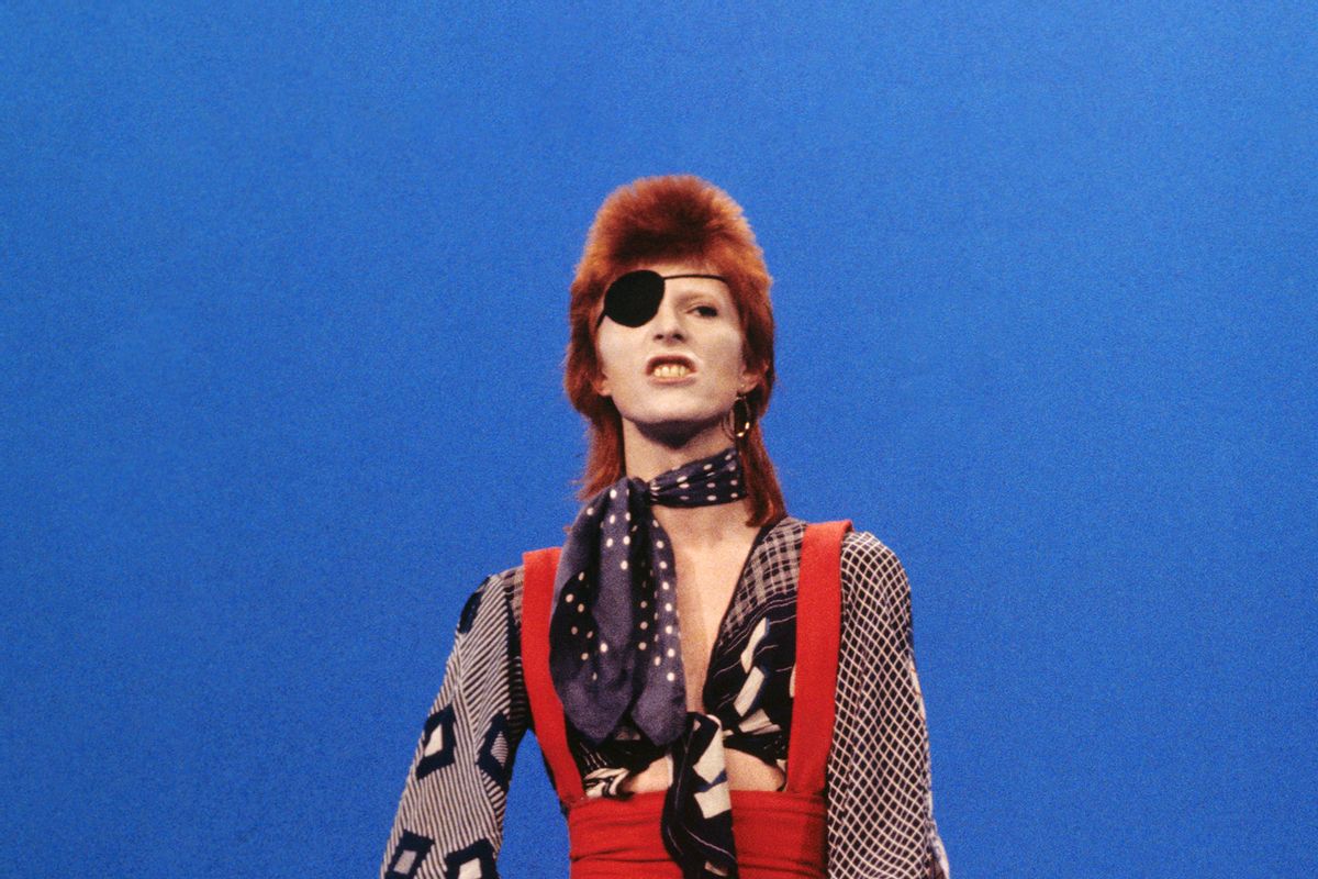 David Bowie (wearing an eyepatch) performs 'Rebel Rebel' on the TV show TopPop on 7th February 1974 in Hilversum, Netherlands. (Gijsbert Hanekroot/Redferns/Getty Images)