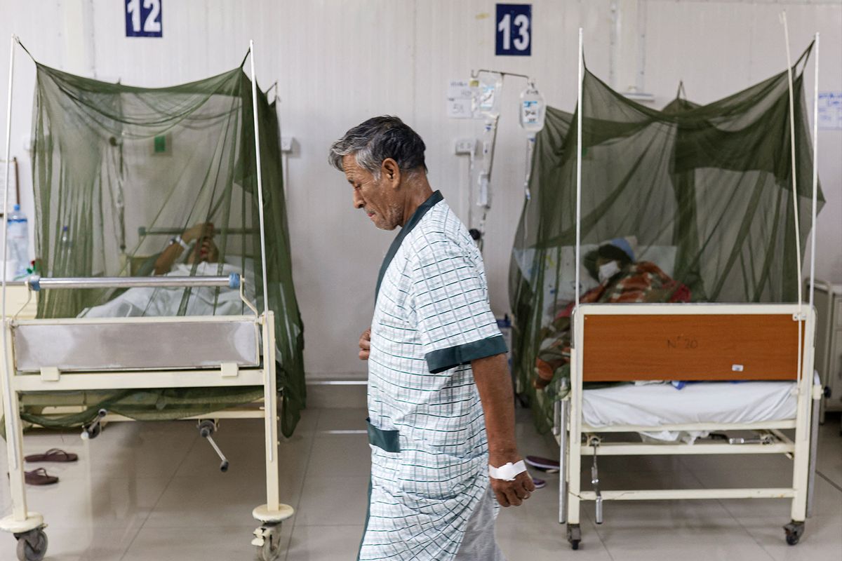 A dengue fever patient walks inside the Sergio Bernales National Hospital in the outskirts of Lima on April 17, 2024. (Juan Carlos CISNEROS / AFP) (Photo by JUAN CARLOS CISNEROS/AFP via Getty Images)