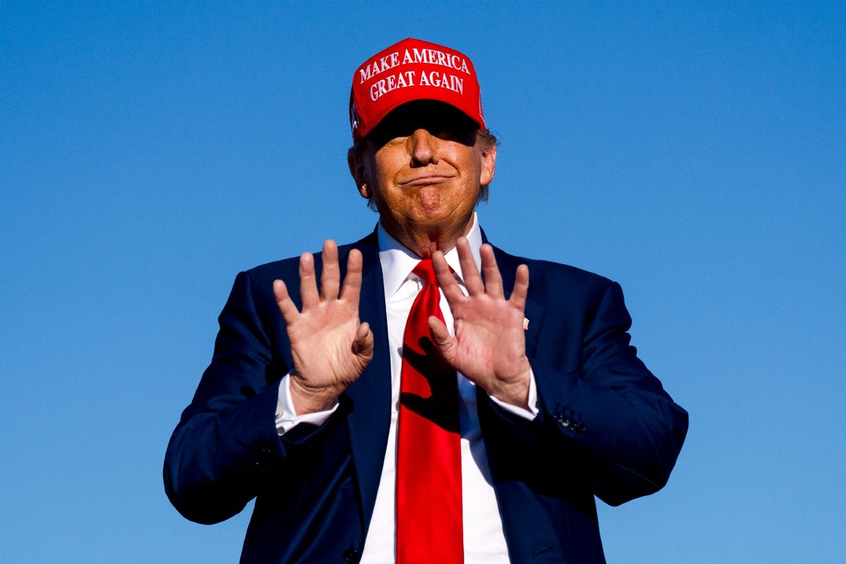 Republican presidential candidate, former U.S. President Donald Trump holds his hands up during a rally on May 1, 2024 at Avflight Saginaw in Freeland, Michigan. (Nic Antaya/Getty Images)