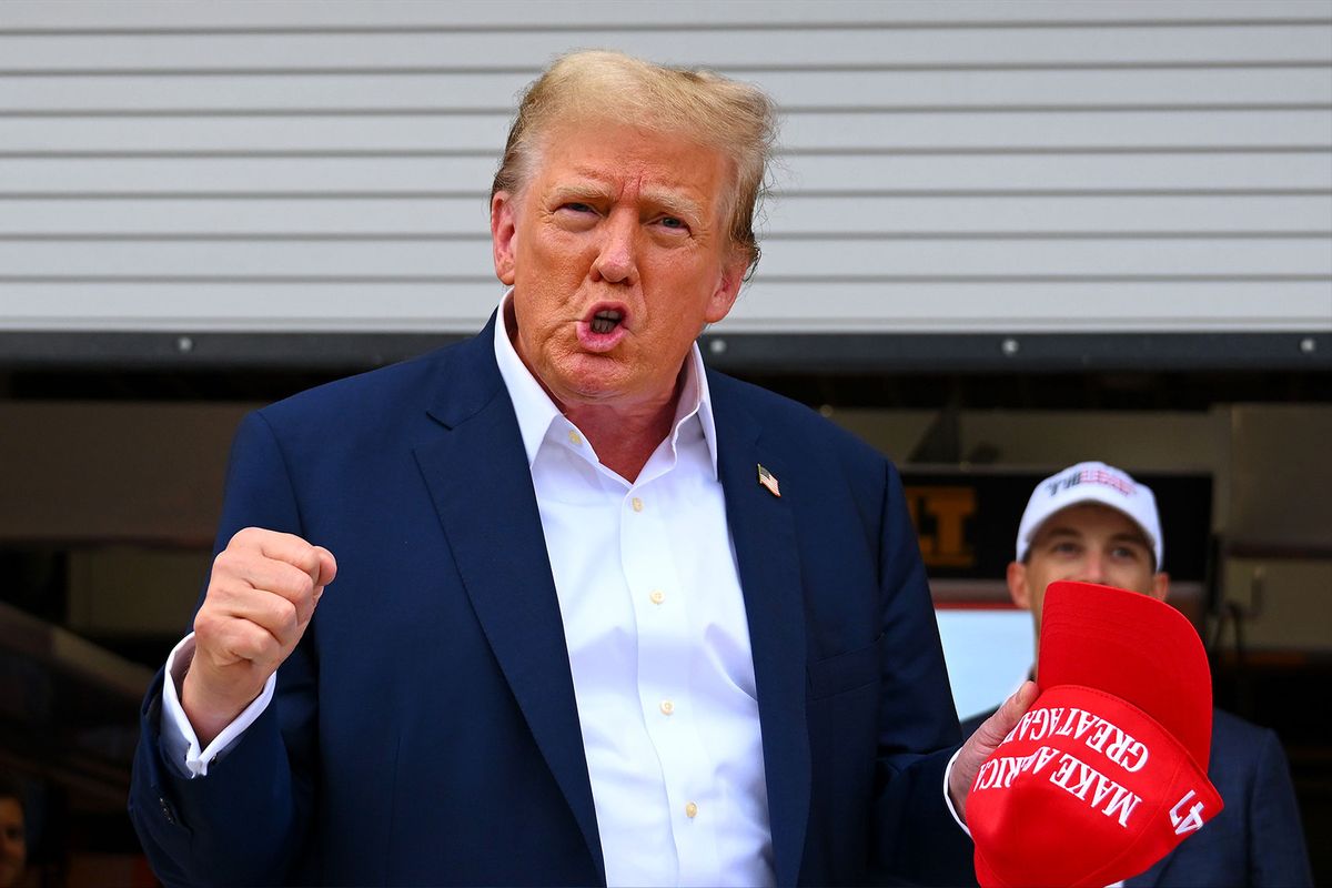 Donald Trump gestures in the Pitlane prior to the F1 Grand Prix of Miami at Miami International Autodrome on May 05, 2024 in Miami, Florida. (Clive Mason/Getty Images)