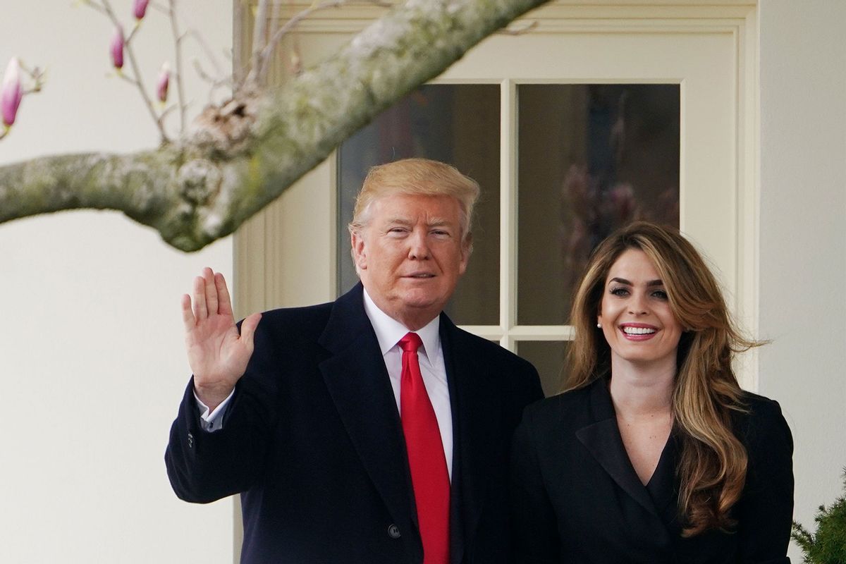 US President Donald Trump poses with former communications director Hope Hicks shortly before departing from the White House on March 29, 2018. (MANDEL NGAN/AFP via Getty Images)