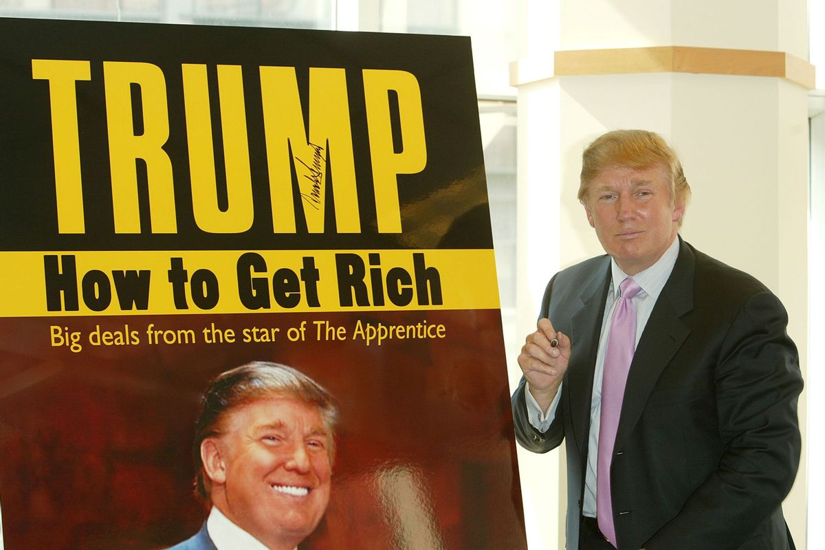 Donald Trump in front of a poster depicting the cover of his book "How To Get Rich" March 24, 2004 at Barnes and Noble in Lincoln Center in New York City. (Peter Kramer/Getty Images)