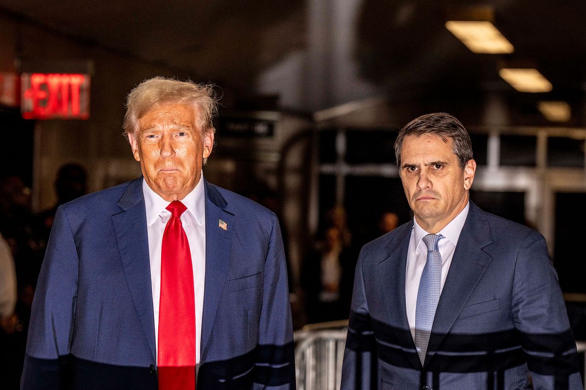 Former US President Donald Trump, standing with attorney Todd Blanche (R), speaks to the press as he leaves for the day during his trial for allegedly covering up hush money payments linked to extramarital affairs, at Manhattan Criminal Court in New York City on April 25, 2024. (MARK PETERSON/POOL/AFP via Getty Images)