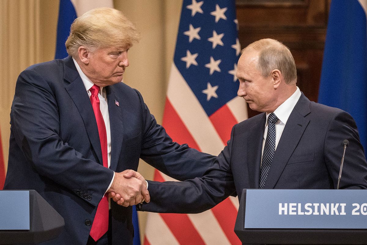 U.S. President Donald Trump (L) and Russian President Vladimir Putin shake hands during a joint press conference after their summit on July 16, 2018 in Helsinki, Finland.  (Chris McGrath/Getty Images)