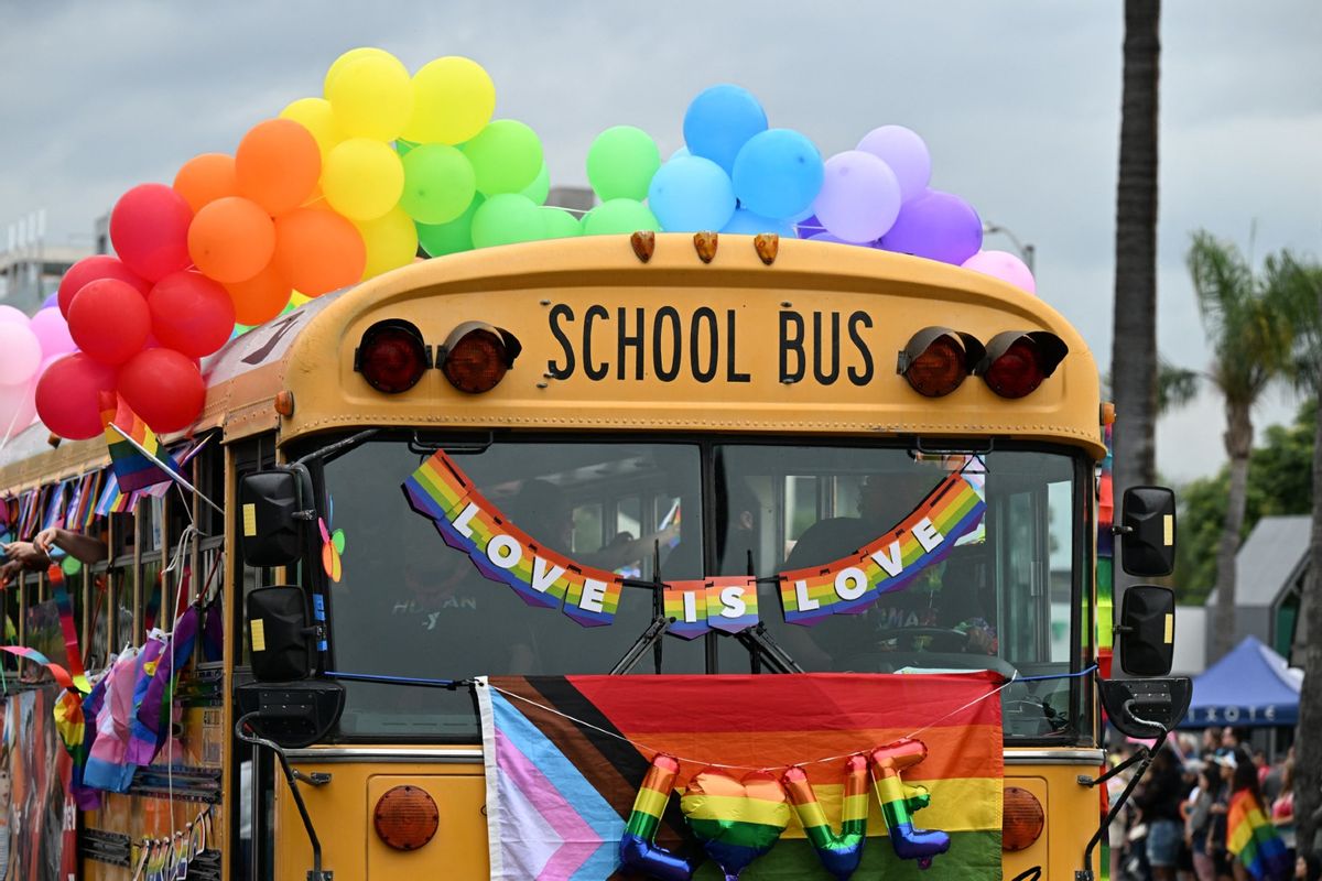 A school bus adorned with rainbow colors. (ROBYN BECK/AFP via Getty Images)