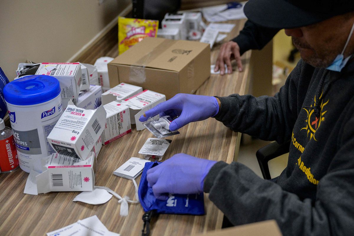 A staff member packs overdose prevention kits, including Narcan nasal spray used to treat narcotic overdoses in an emergency situation, at St. Ann's Corner of Harm Reduction in New York City on April 24, 2023. (ANGELA WEISS/AFP via Getty Images)