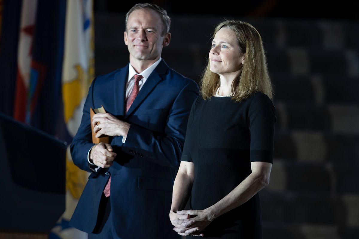 Newly sworn in U.S. Supreme Court Associate Justice Amy Coney Barrett and her husband Jesse Barrett look on during her ceremonial swearing-in on the South Lawn of the White House October 26, 2020 in Washington, DC.  (Tasos Katopodis/Getty Images)