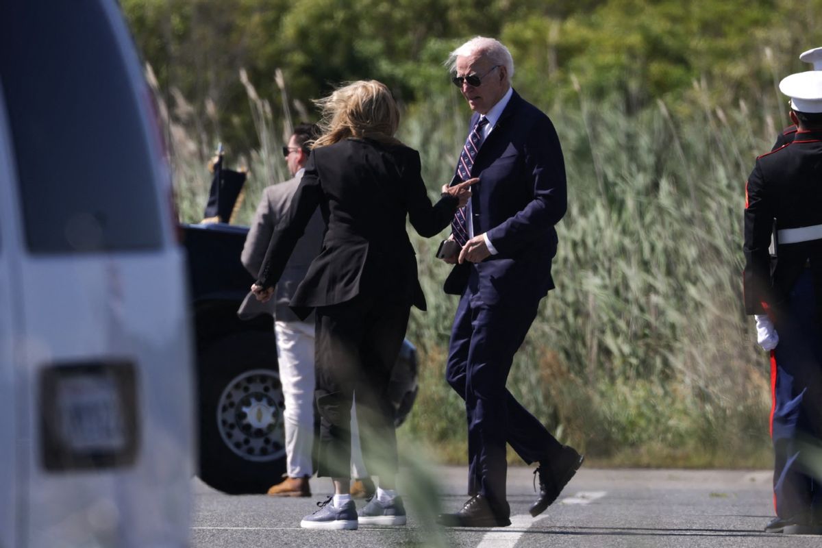 U.S. President Joe Biden speaks with First Lady Jill Biden after exiting Marine One upon arrival at Gordons Pond landing zone in Rehoboth Beach, Delaware on May 30, 2024. (SAMUEL CORUM/AFP via Getty Images)