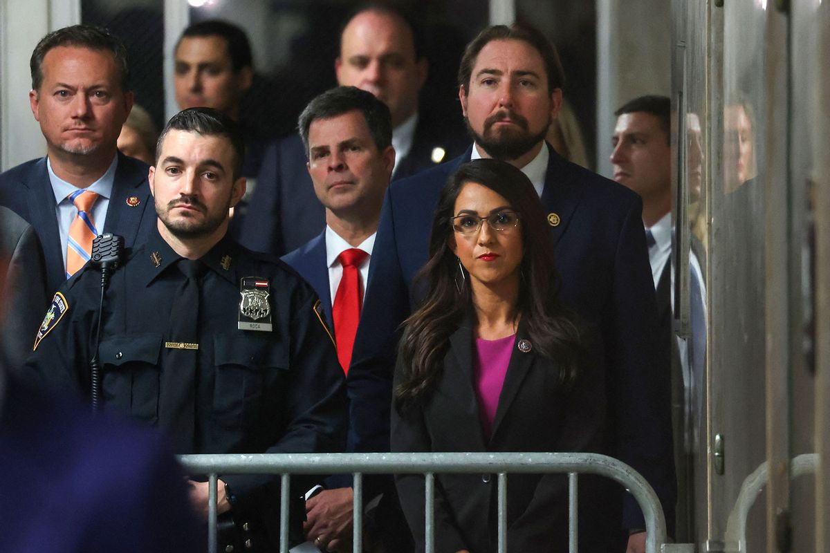 Rep. Lauren Boebert (R) (R-CO) looks on as former US President Donald Trump speaks to the press before his trial for allegedly covering up hush money payments linked to extramarital affairs, at Manhattan Criminal Court in New York City, on May 16, 2024. (MIKE SEGAR/POOL/AFP via Getty Images)