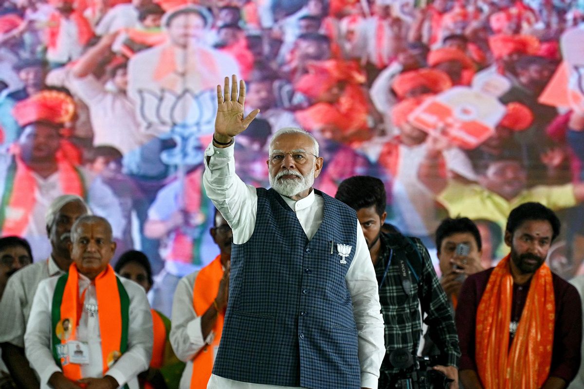 Narendra Modi (C), India's Prime Minister and leader of the ruling Bharatiya Janata Party (BJP) waves to his supporters during a public meeting in Hyderabad on May 10, 2024, ahead of the fourth phase of voting of the country's general election. (NOAH SEELAM/AFP via Getty Images)