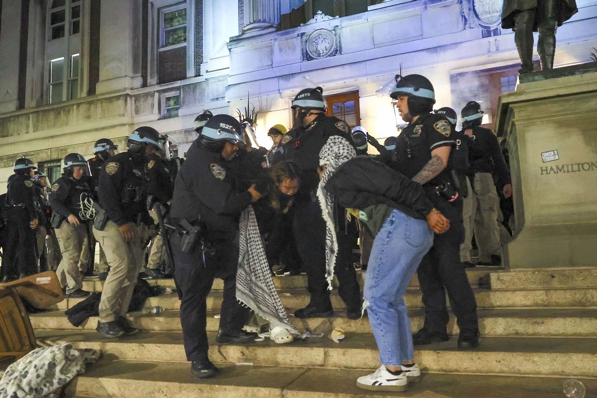 New York Police Department officers detain dozens of pro-Palestinian students at Columbia University after they barricaded themselves at the Hamilton Hall building near Gaza Solidarity Encampment earlier in New York, United States on April 30, 2024. (Selcuk Acar/Anadolu via Getty Images)