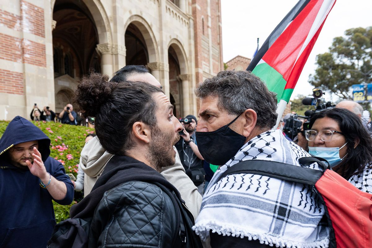 Pro-Israel demonstrator and Pro-Palestinian demonstrator clash with each other on the campus of the University of California Los Angeles (UCLA) on April 25, 2024 in Los Angeles, California. (Qian Weizhong/VCG via Getty Images)