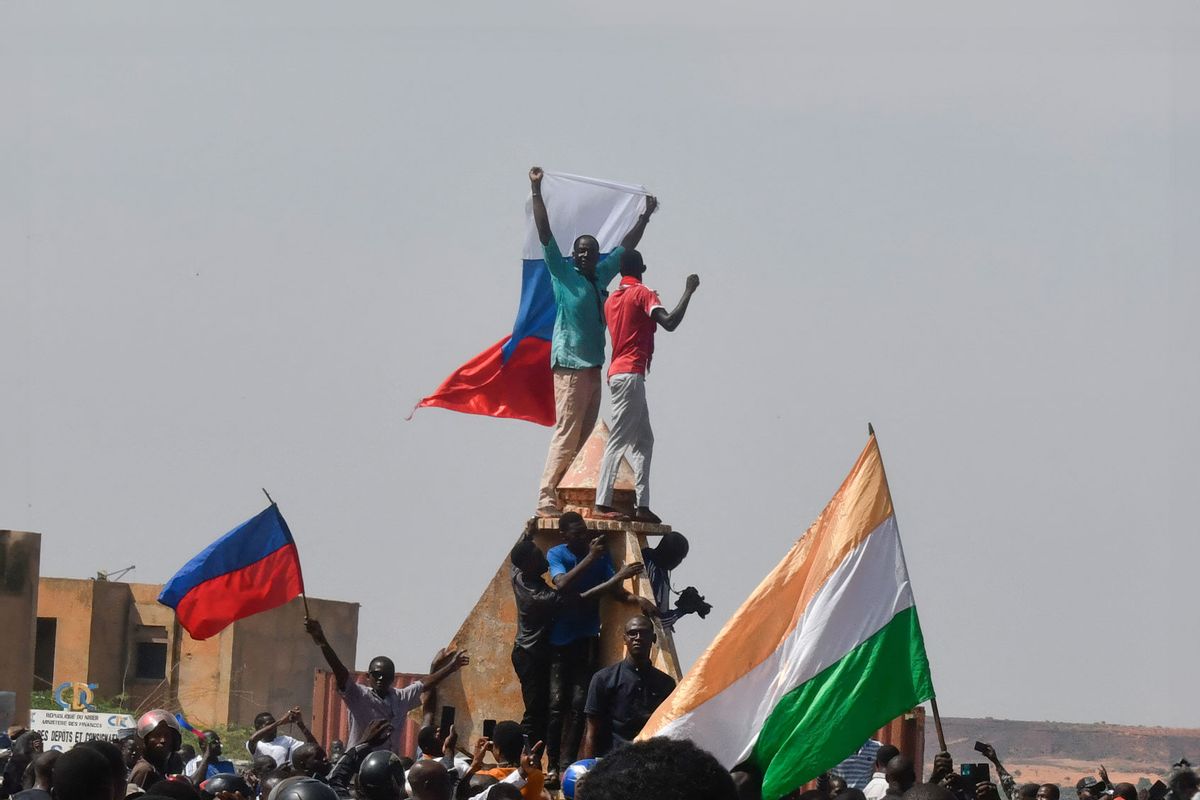 Protesters wave Nigerien and Russian flags as they gather during a rally in support of Niger's junta in Niamey on July 30, 2023. (AFP via Getty Images)