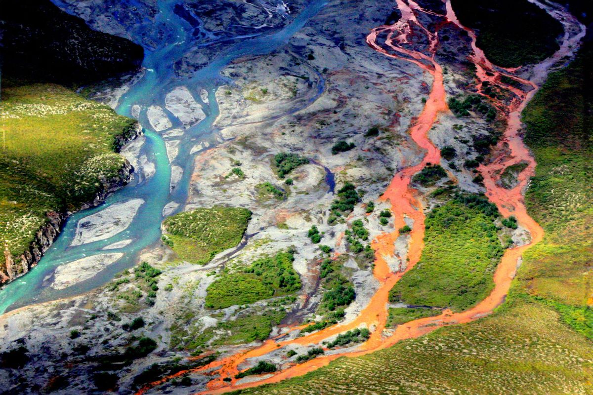 An aerial view of the rust-colored Kutuk River in Gates of the Arctic National Park in Alaska.
Thawing permafrost is exposing minerals to weathering, increasing the acidity of the water,
which releases metals like iron, zinc and copper. (Ken Hill / National Park Service)
