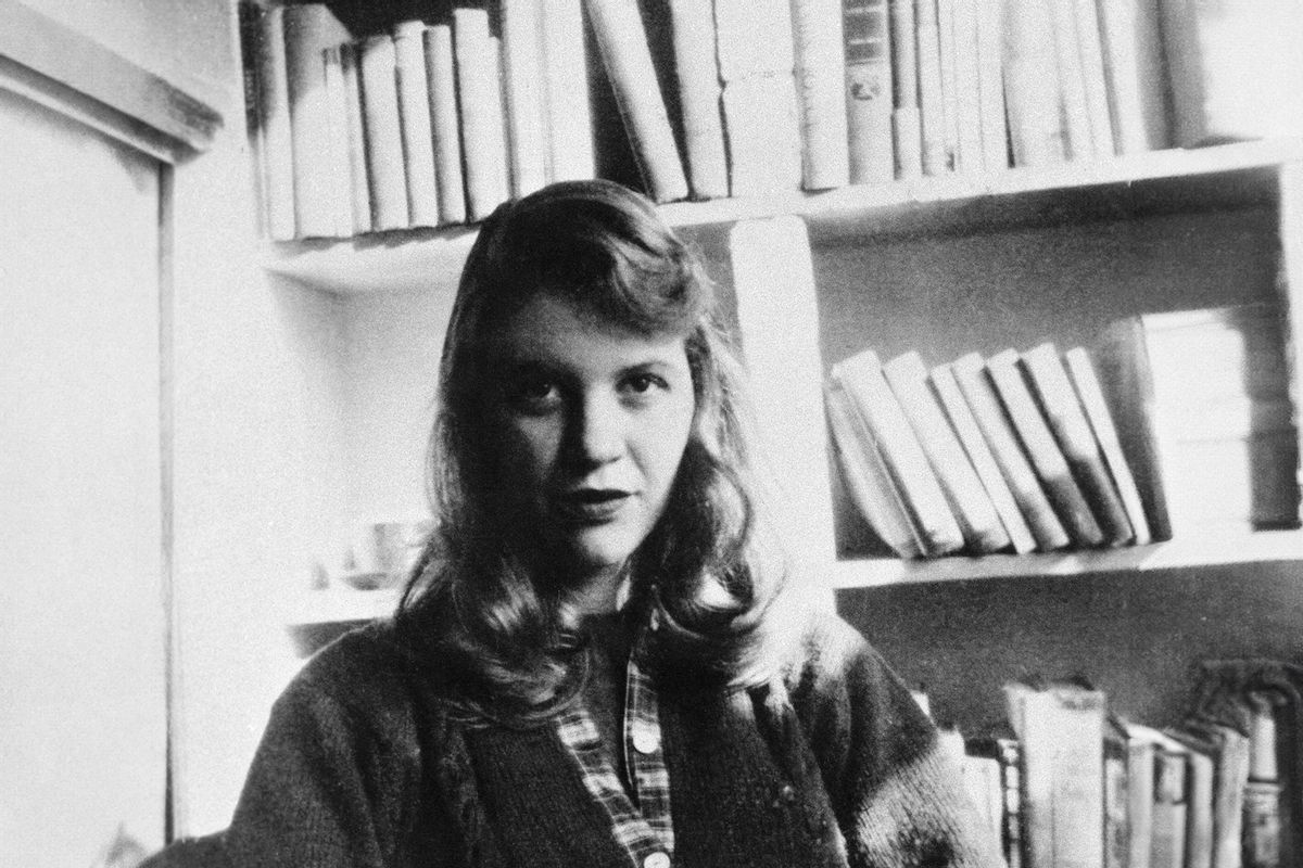 Sylvia Plath seated in front of a bookshelf (Getty Images/Bettmann)