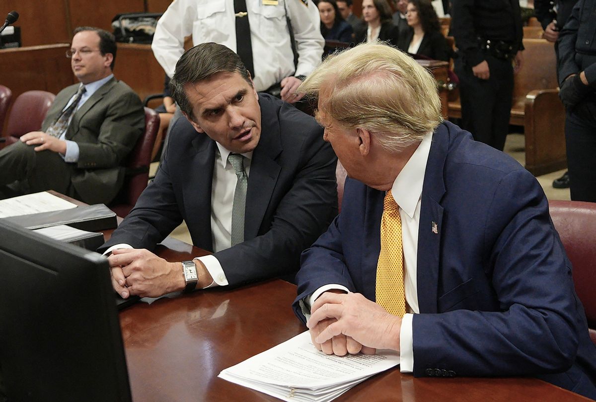 Former President Donald Trump speaks with lawyer Todd Blanche before Trump's trial for allegedly covering up hush money payments linked to extramarital affairs, at Manhattan Criminal Court in New York City, on May 14, 2024.  (CURTIS MEANS/POOL/AFP via Getty Images)