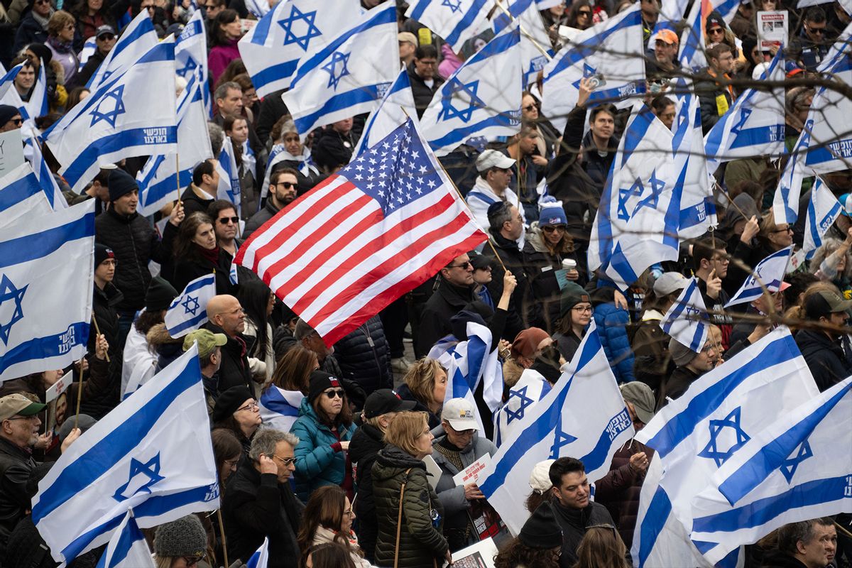 Demonstrators hold US and Israeli flags during a rally in Central Park marking 150 days since hostages were taken in attack on Israel on March 10, 2024 in New York City. (Noam Galai/Getty Images)