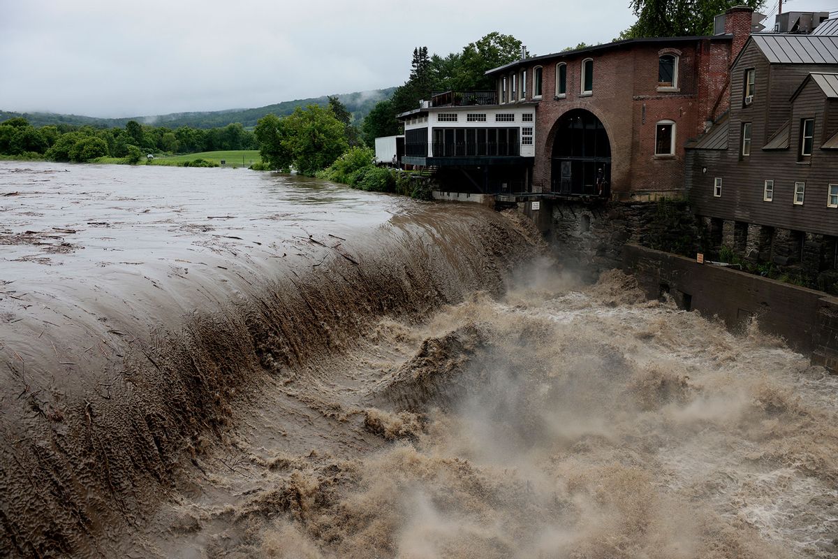 Heavy rain and flash flooding sends mud and debris down the Ottauquechee River, July 10, 2023. (Jessica Rinaldi/The Boston Globe via Getty Images)