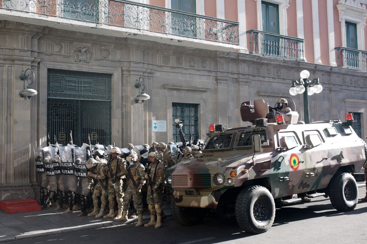 Military members stand guard with an armored truck outside the government palace at Plaza Murillo on June 26, 2024, in La Paz, Bolivia. (Gaston Brito Miserocchi/Getty Images)