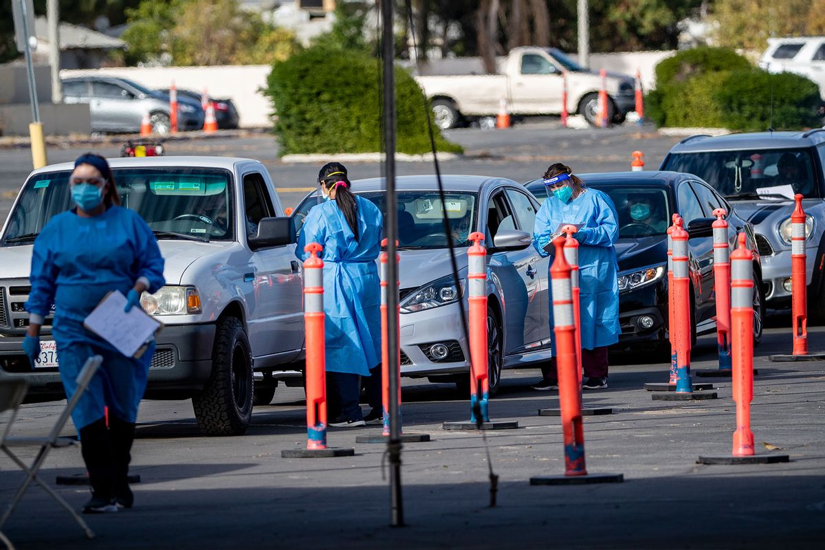 Drivers wait in a long line of cars for a COVID-19 test at a drive-through test site on December 9, 2020 in Riverside, California. (Gina Ferazzi / Los Angeles Times via Getty Images)