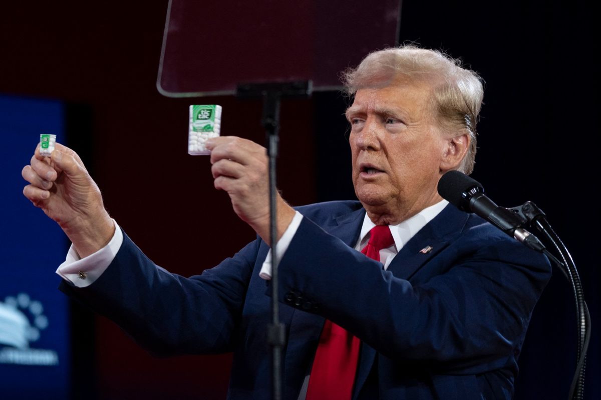 Former U.S. President and Republican presidential candidate Donald Trump holds packages of Tic Tacs as he delivers the keynote address at the Faith & Freedom Coalition's 2024 Road to Majority Conference in Washington, DC, on June 22, 2024. (CHRIS KLEPONIS/AFP via Getty Images)
