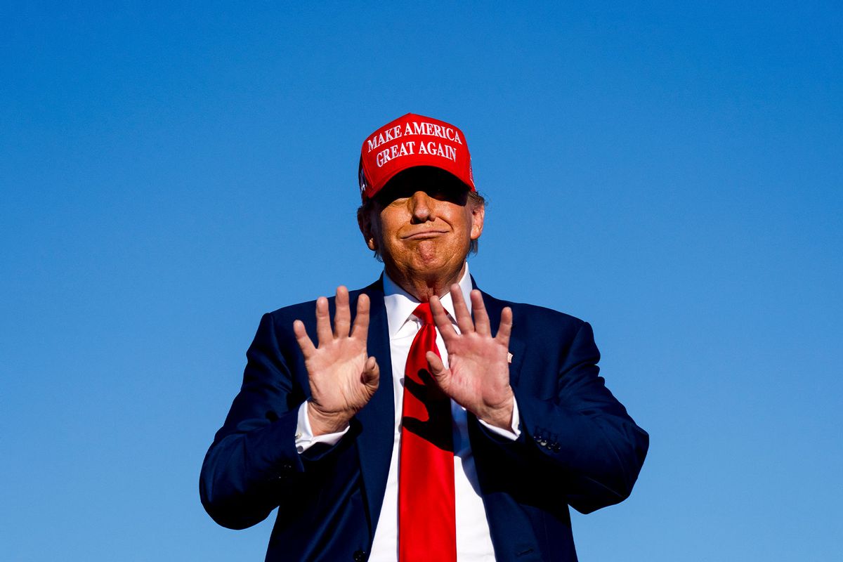 Republican presidential candidate, former U.S. President Donald Trump holds his hands up during a rally on May 1, 2024 at Avflight Saginaw in Freeland, Michigan. (Nic Antaya/Getty Images)