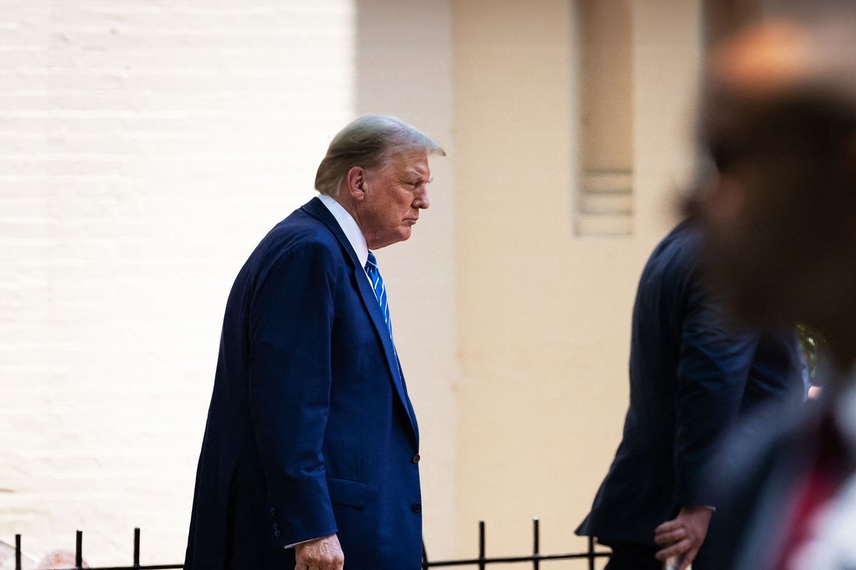 Former President Donald Trump walks to his car after meeting with Senate Republicans at the National Republican Senatorial Committee offices in Washington, DC, June 13, 2024. (ALLISON BAILEY/Middle East Images/AFP via Getty Images)