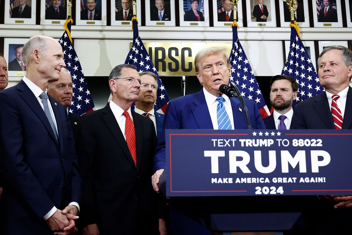 Republican presidential candidate, former U.S. President Donald Trump, is flanked by Senate Republicans as he gives remarks to the press at the National Republican Senatorial Committee building on June 13, 2024 in Washington, DC. (Anna Moneymaker/Getty Images)