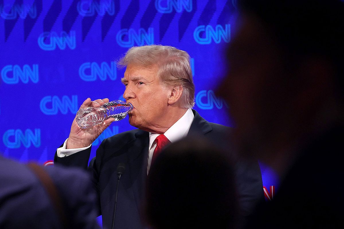 Republican presidential candidate, former U.S. President Donald Trump drinks water during a break in the CNN Presidential Debate at the CNN Studios on June 27, 2024 in Atlanta, Georgia. (Justin Sullivan/Getty Images)